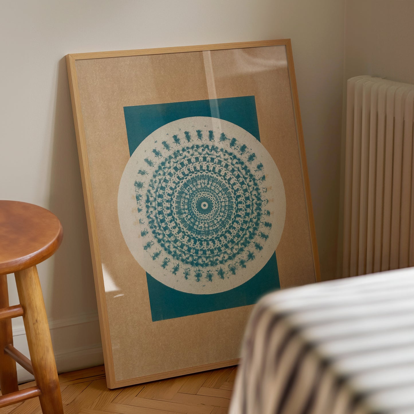 Maxwell Prints' Desert Bauhaus II mandala art print in a wooden frame. The warm desert tones and minimalist geometry perfectly complement the modern, understated decor.
