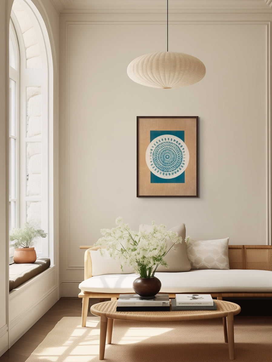 "Desert Bauhaus II" mandala print, 24x30 inches, in walnut frame, complementing a bright and modern living room ambiance with muted tan and greenish blue hues.